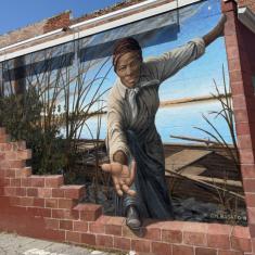 Photograph of a painted mural of Harriet Tubman extending her hand 